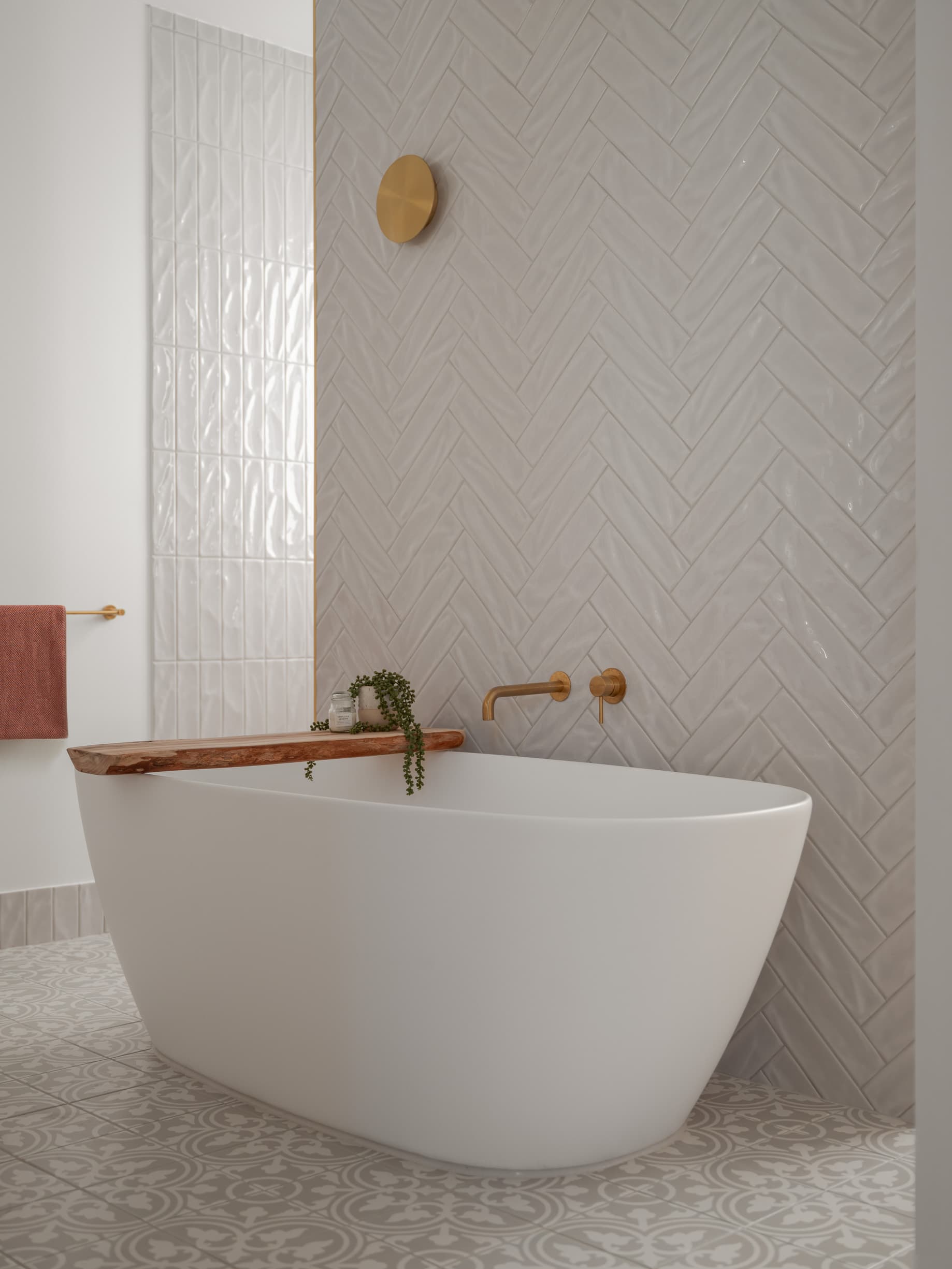 Harding House freestanding bath against a herringbone-tiled wall