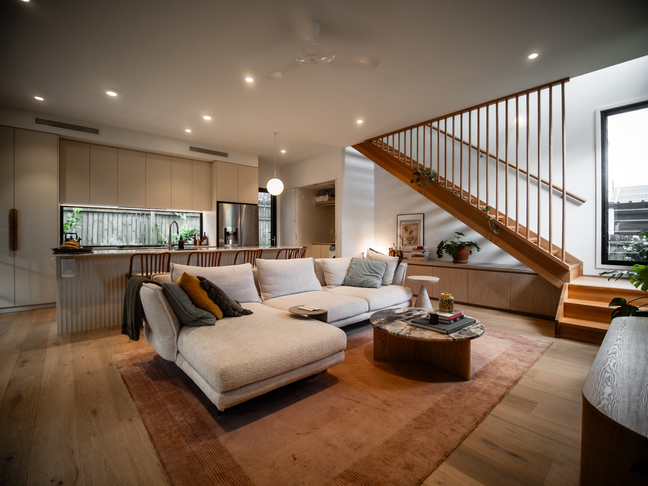 Jacaranda Highside open-plan living and kitchen with the timber stair beyond