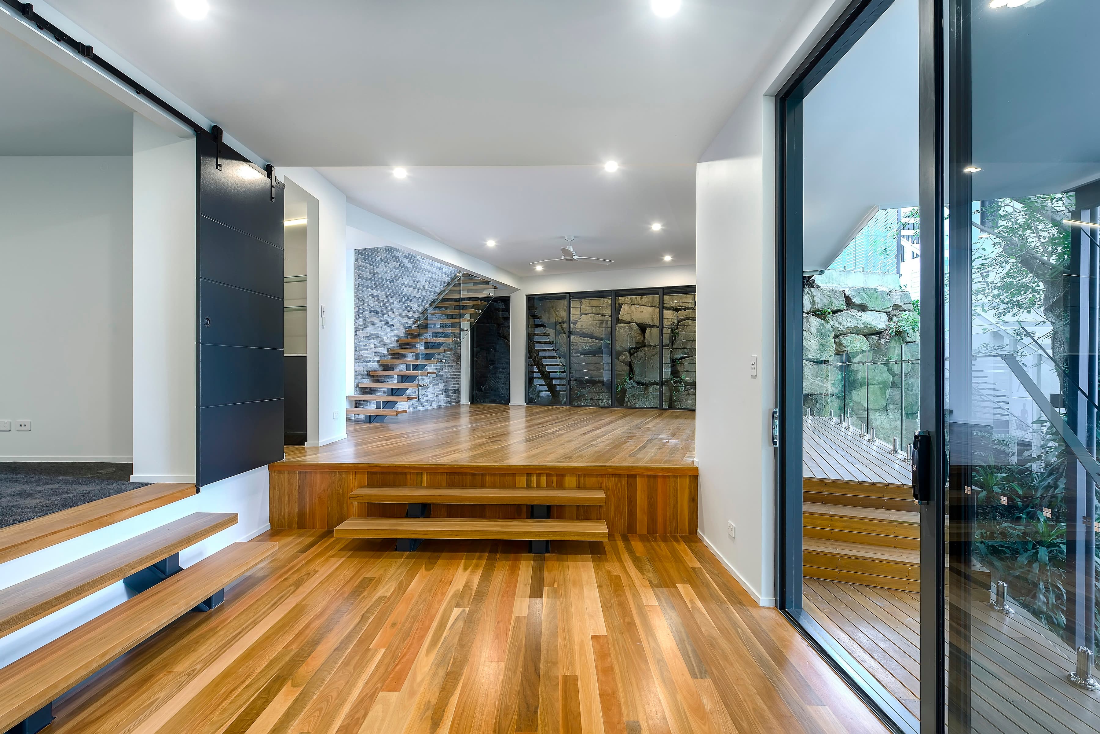 Langside Road lower level looking to the floating stair and the boulder wall
