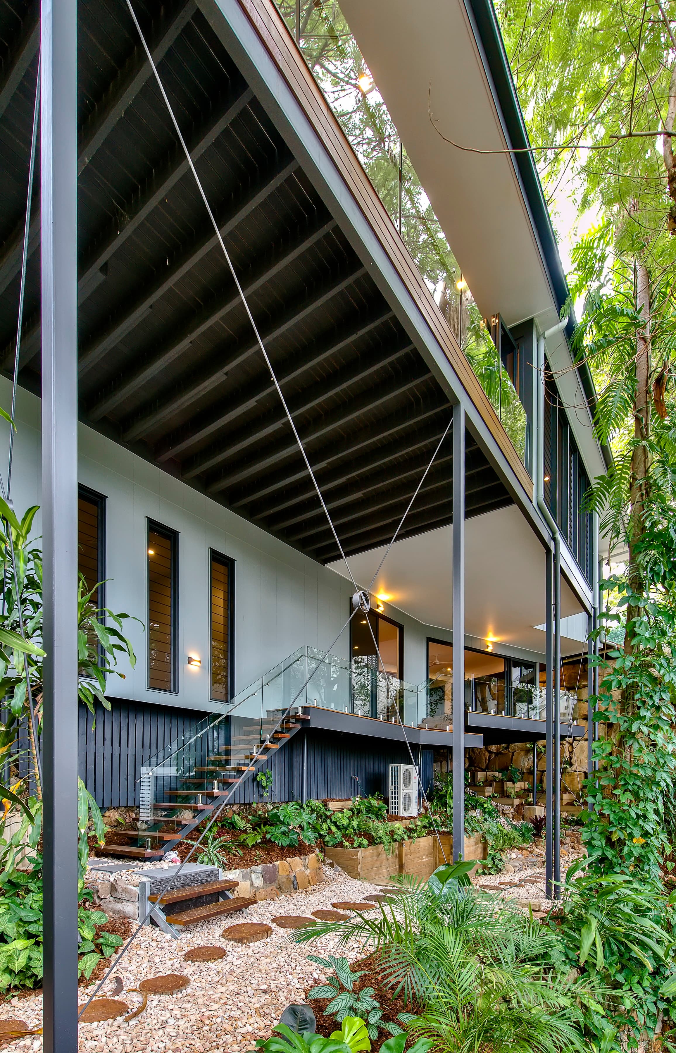 Langside Road raised on steel columns above a landscaped rock garden