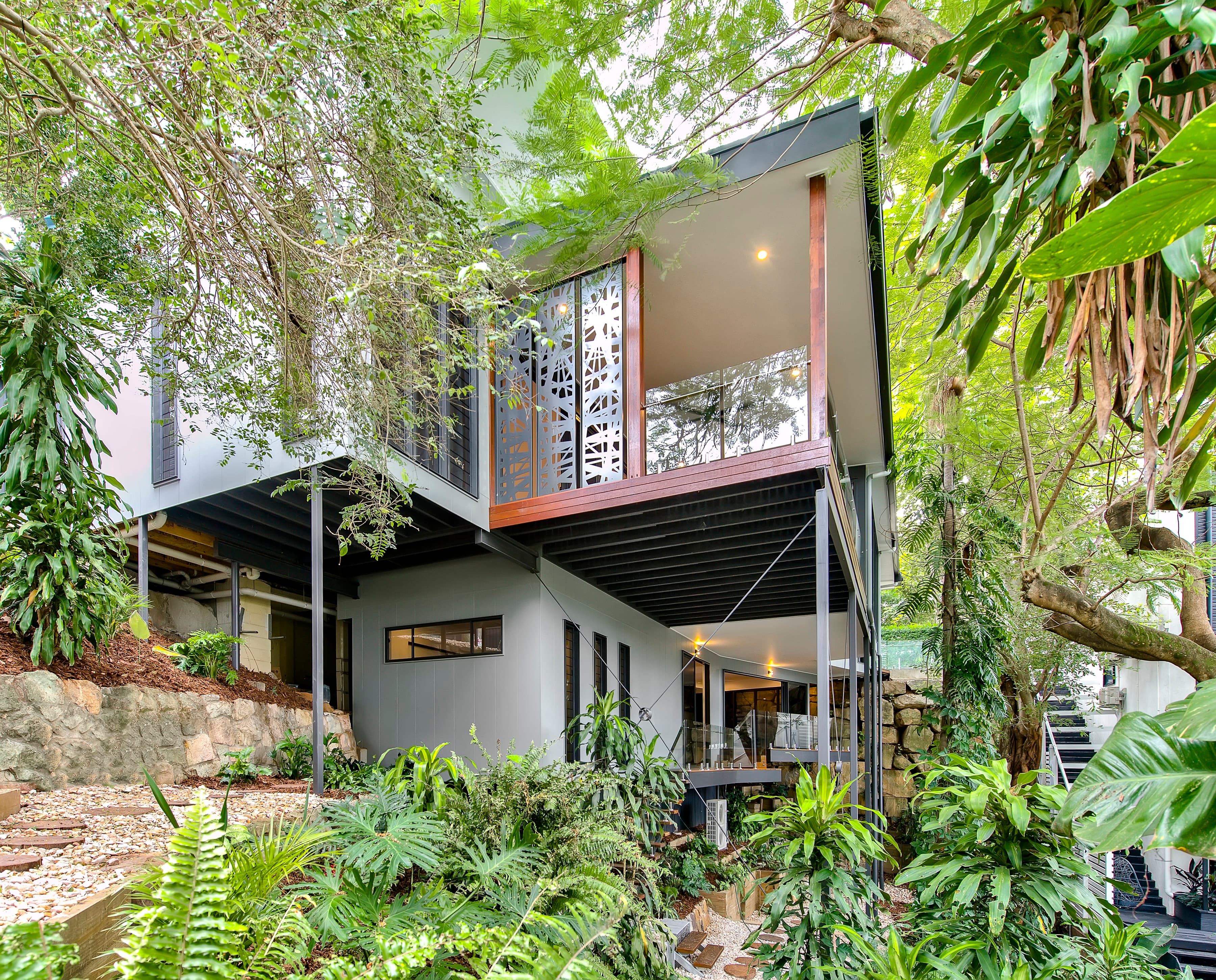 Langside Road among rainforest planting, laser-cut screen to the upper balcony