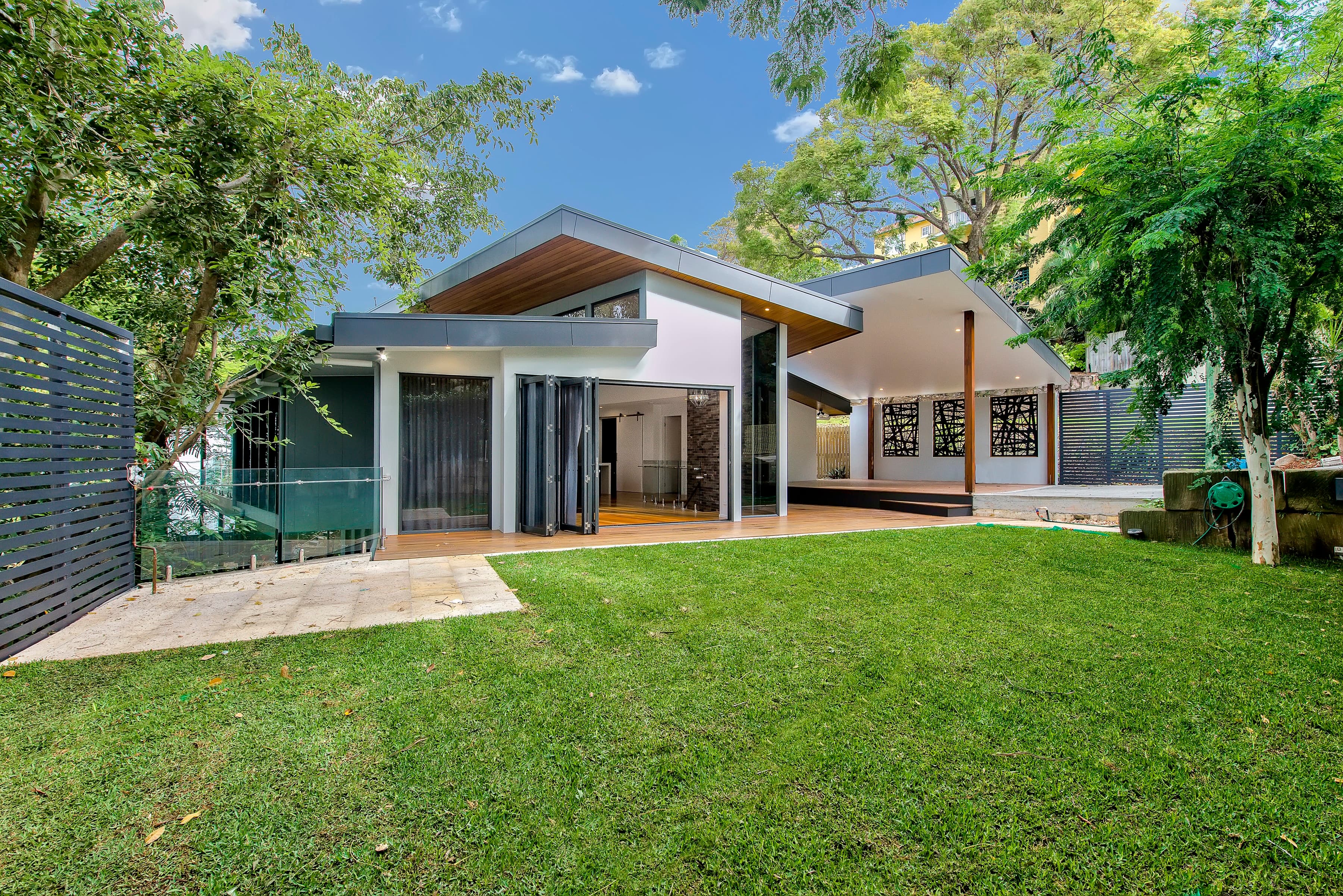 Langside Road rear elevation and lawn with skillion roofs and a covered pavilion