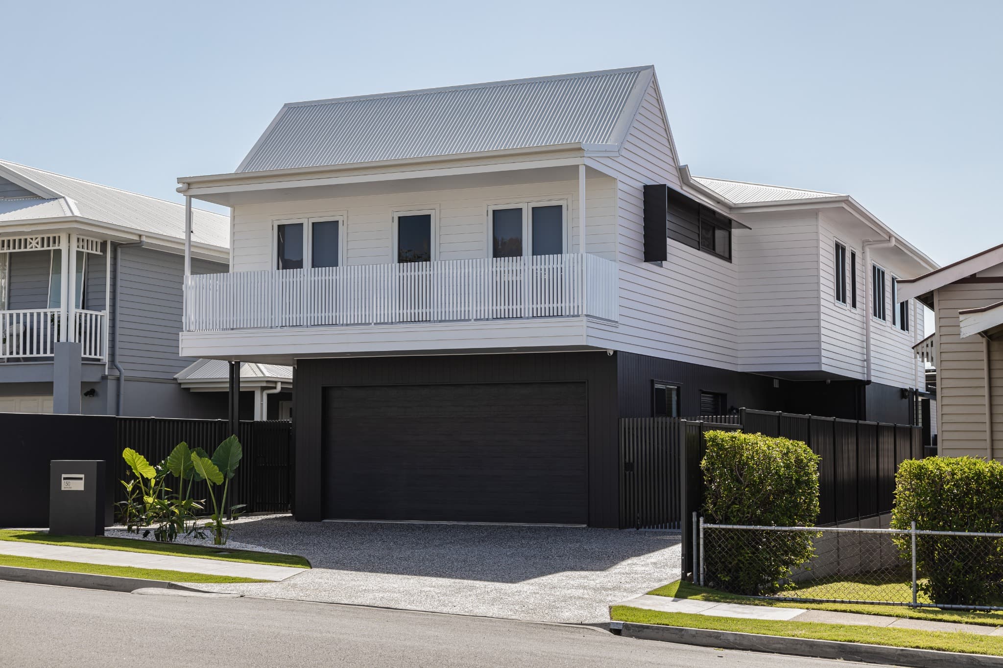 Melville Terrace street elevation with a weatherboard upper storey over a dark garage