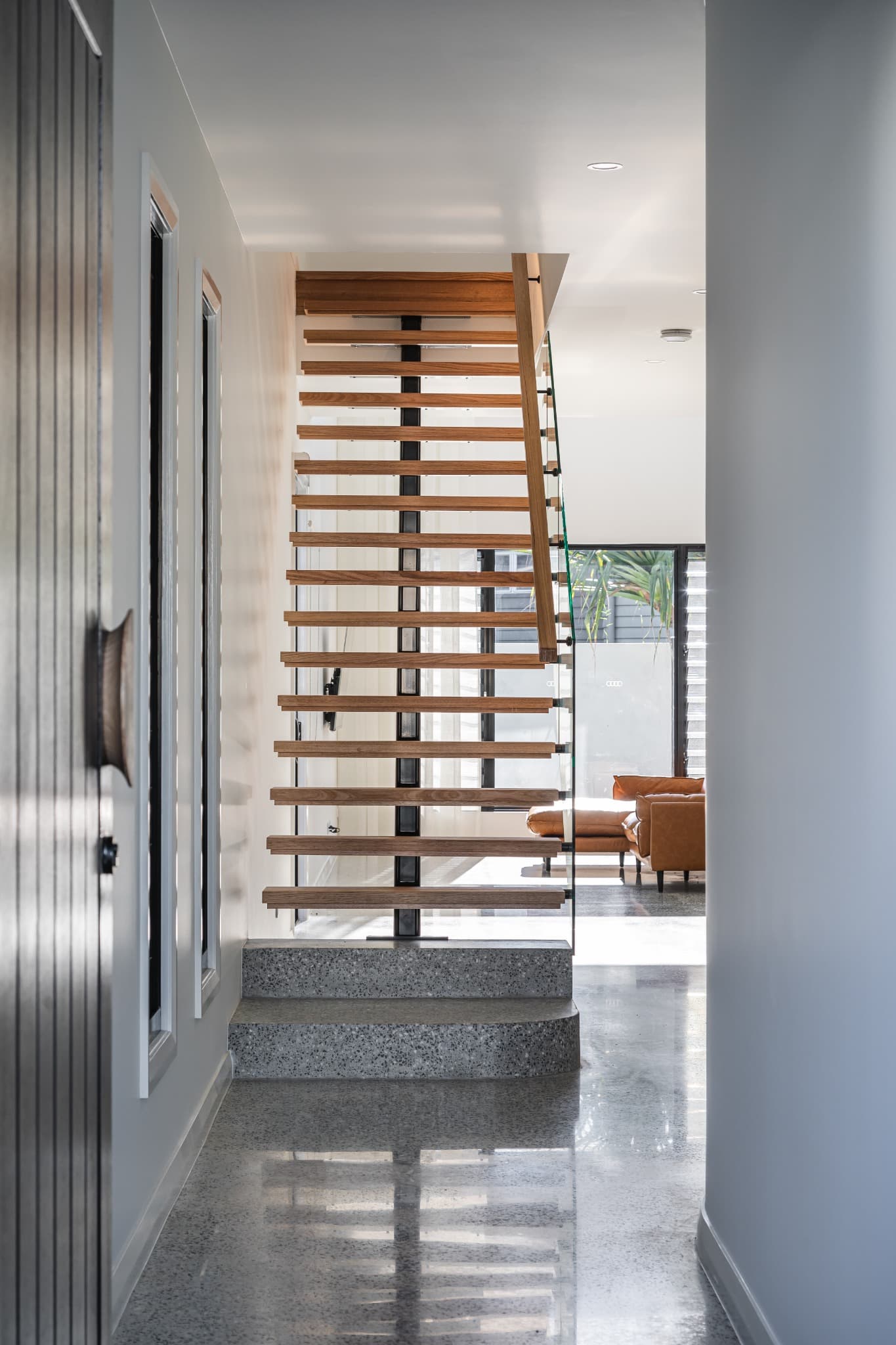 Melville Terrace entry hall with an open-tread timber stair on a steel spine