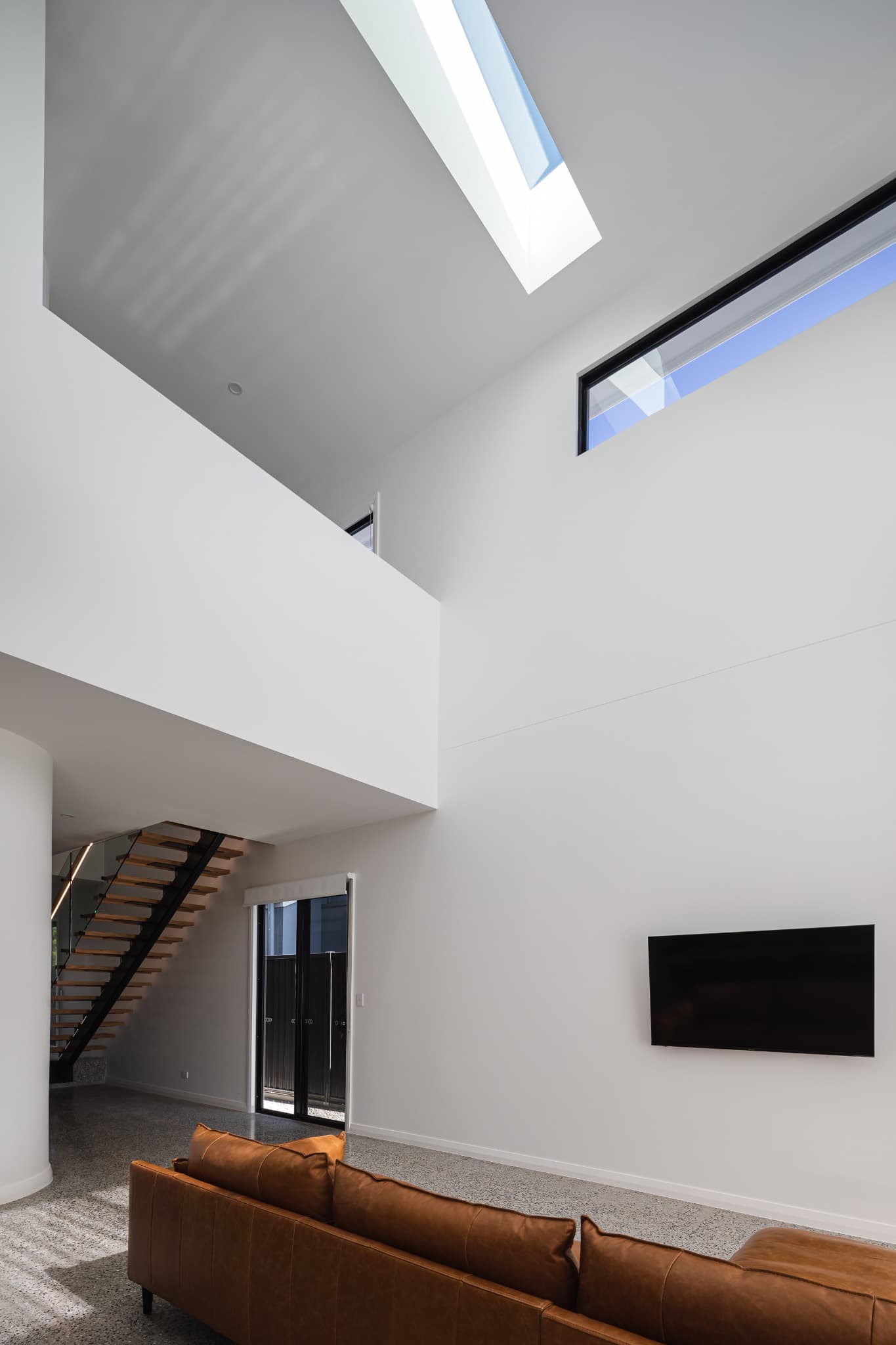 Melville Terrace living void lit by a skylight and clerestory window
