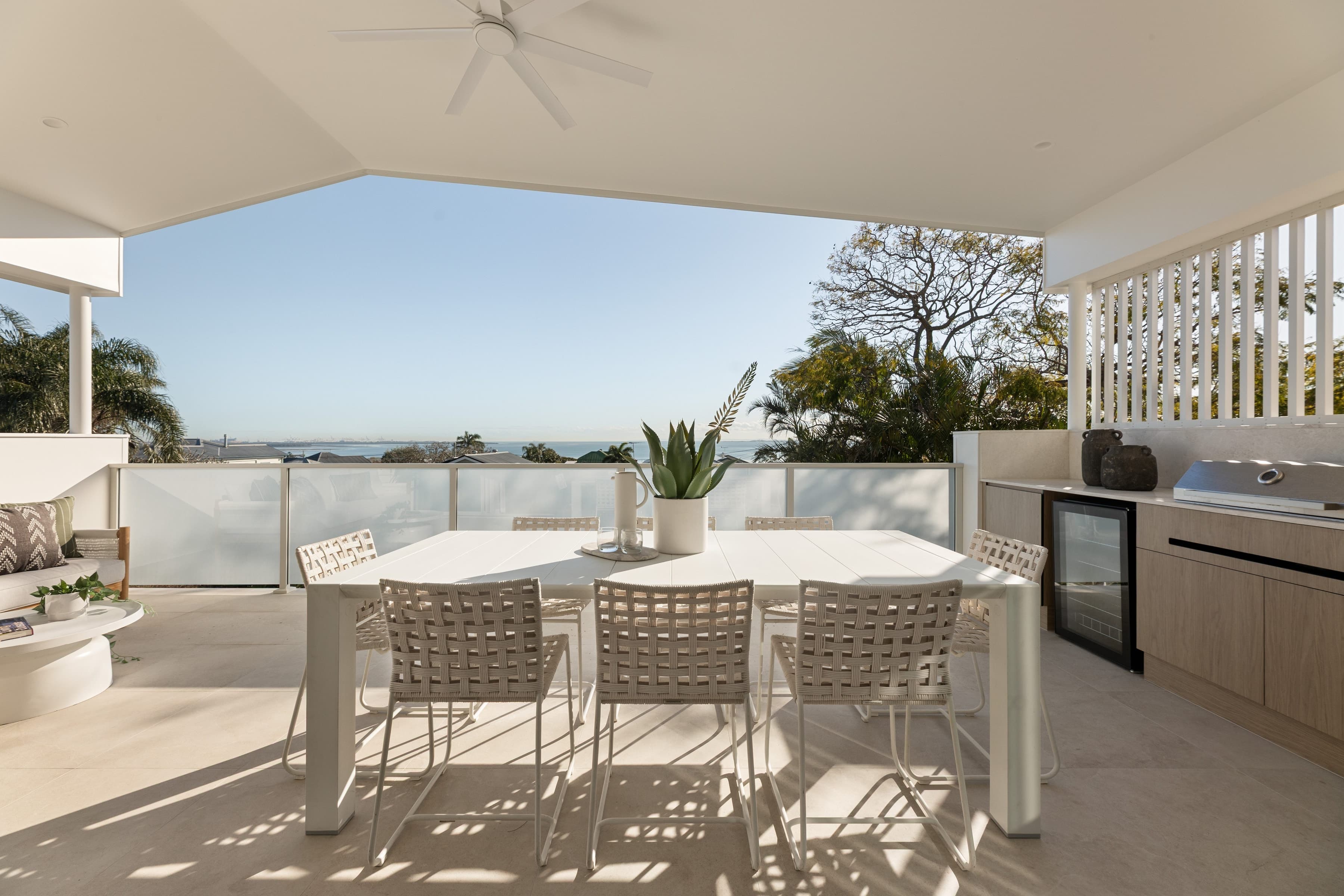 Mesa upper balcony with an outdoor kitchen and dining, looking out over the bay