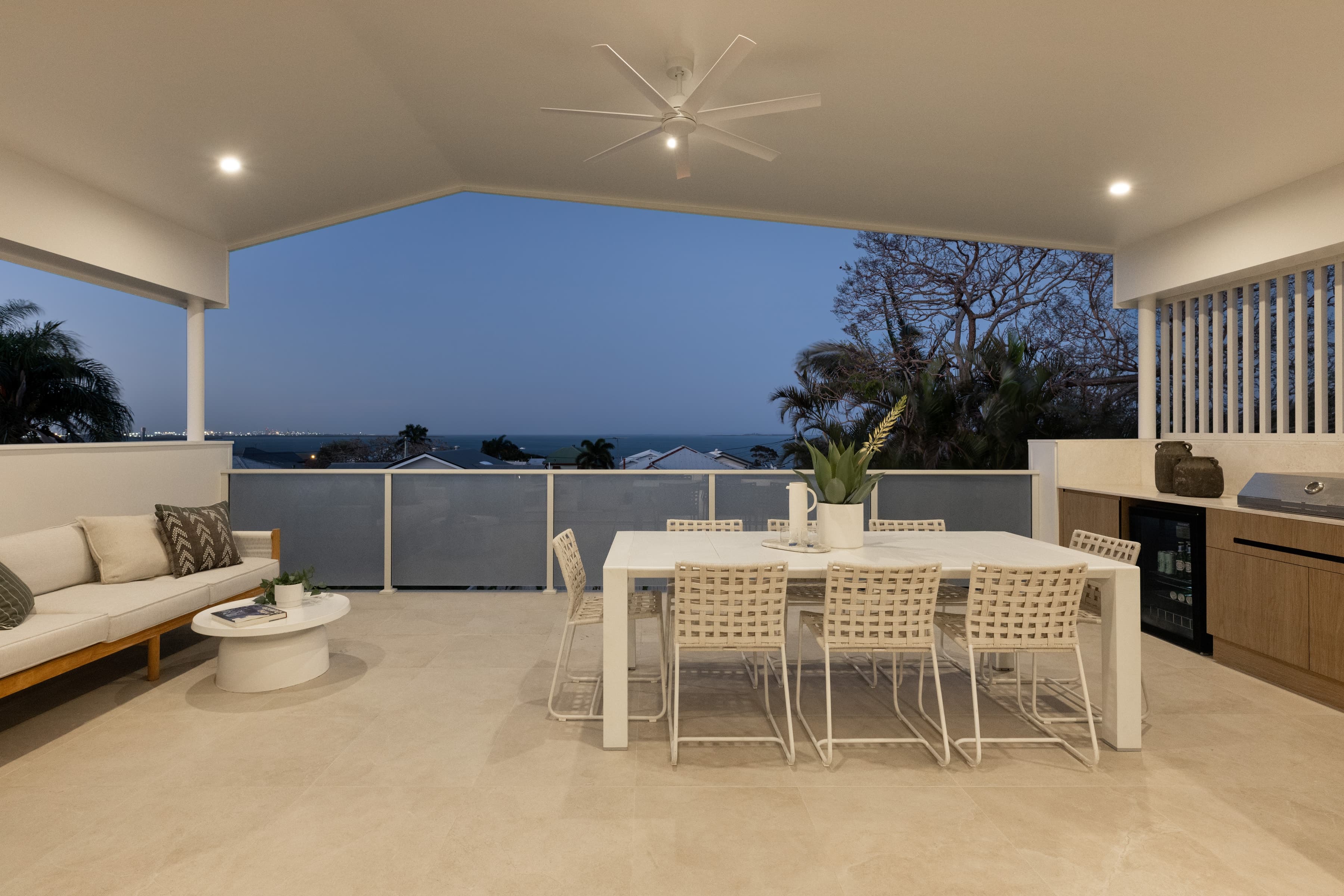 Mesa upper balcony at dusk with the bay and distant city lights