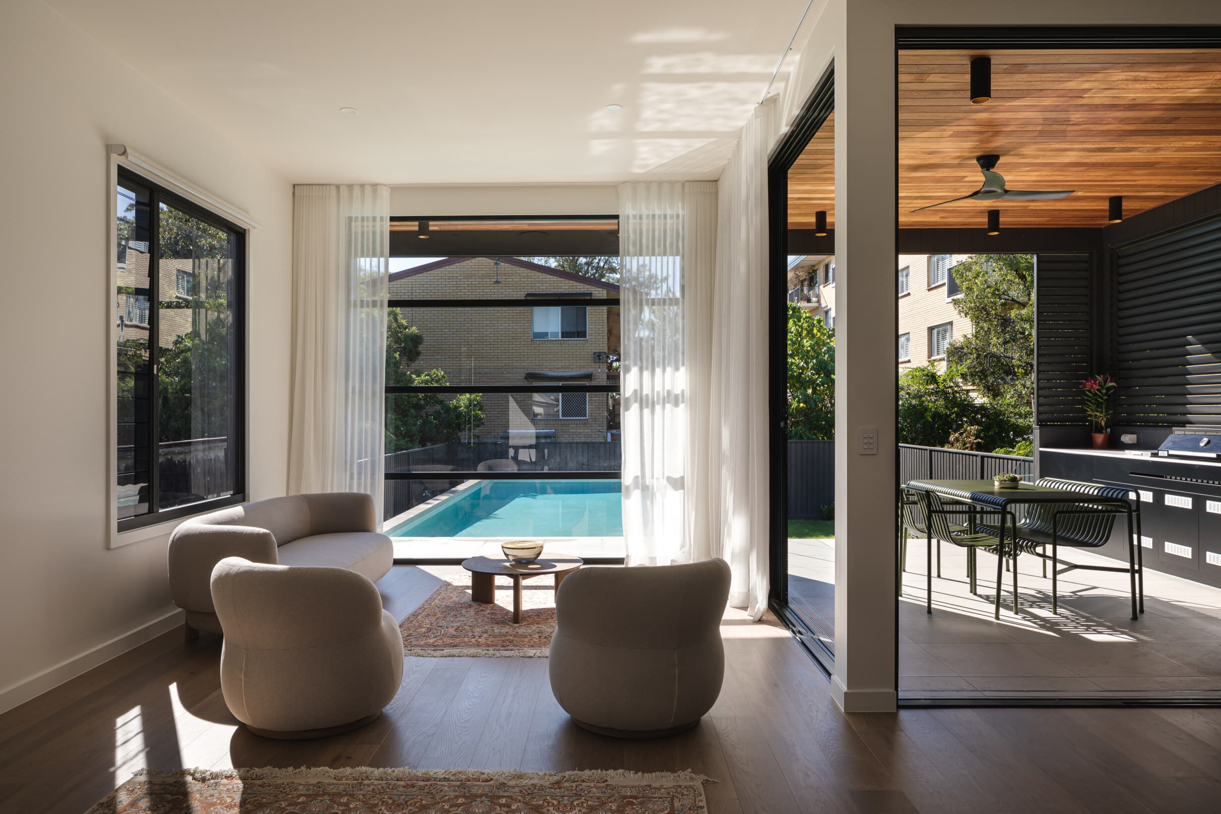 Z House living room opening to the pool and covered terrace