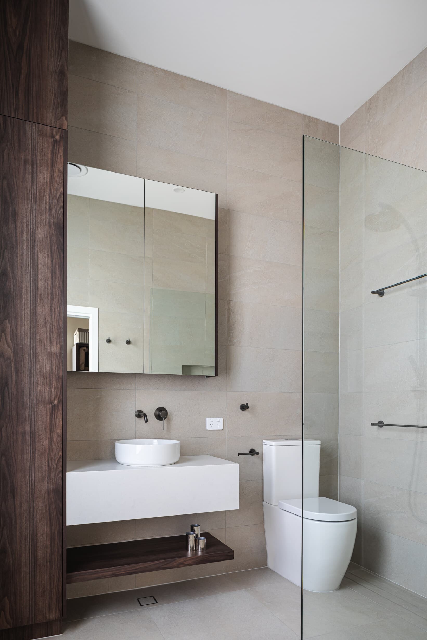 Z House bathroom with walnut joinery and a walk-in shower