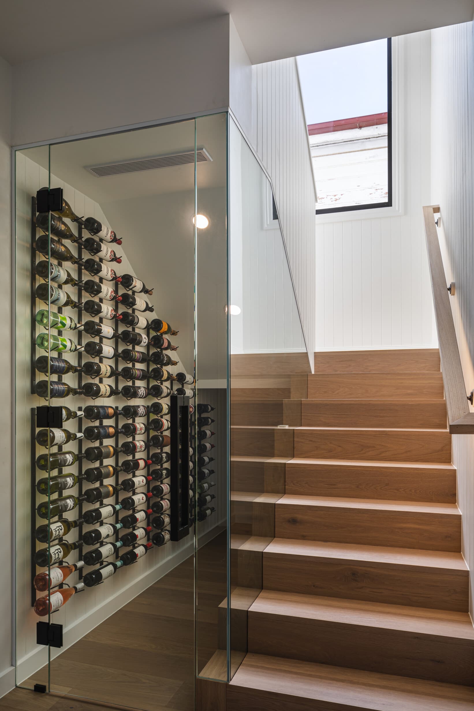 Z House glazed wine store beside the oak stair